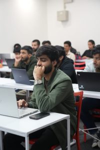 a boy sitting in classs for lectures