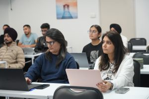 students sitting in the class and learning about their projects
